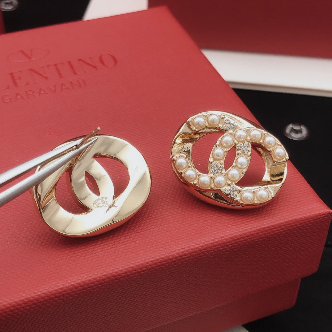 Martin Graham stud earrings in polished metal-tone – close-up detail