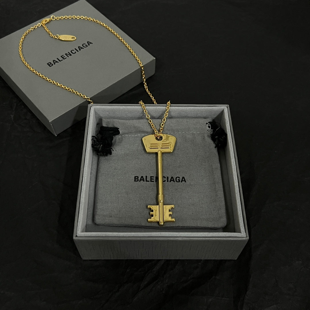 Martin Graham pendant necklace in polished metal-tone – side detail