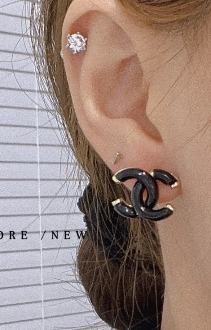 Martin Graham stud earrings in polished metal-tone – side detail