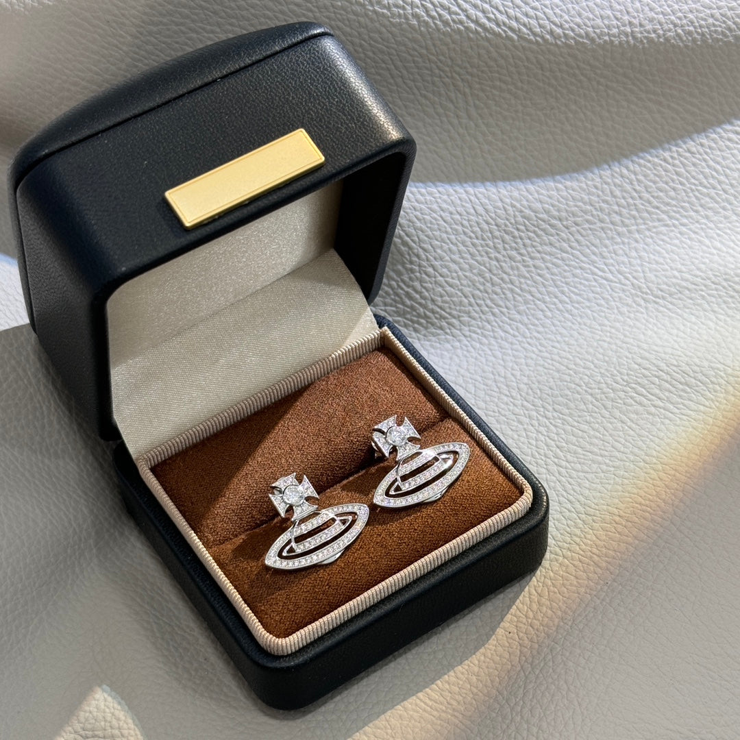 Martin Graham stud earrings in polished metal-tone – styled product view