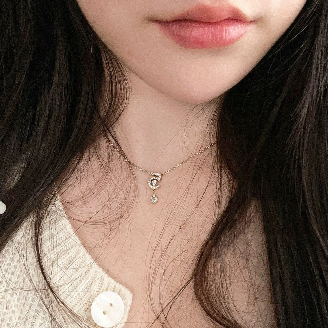 Martin Graham pendant necklace in polished metal-tone – detail view