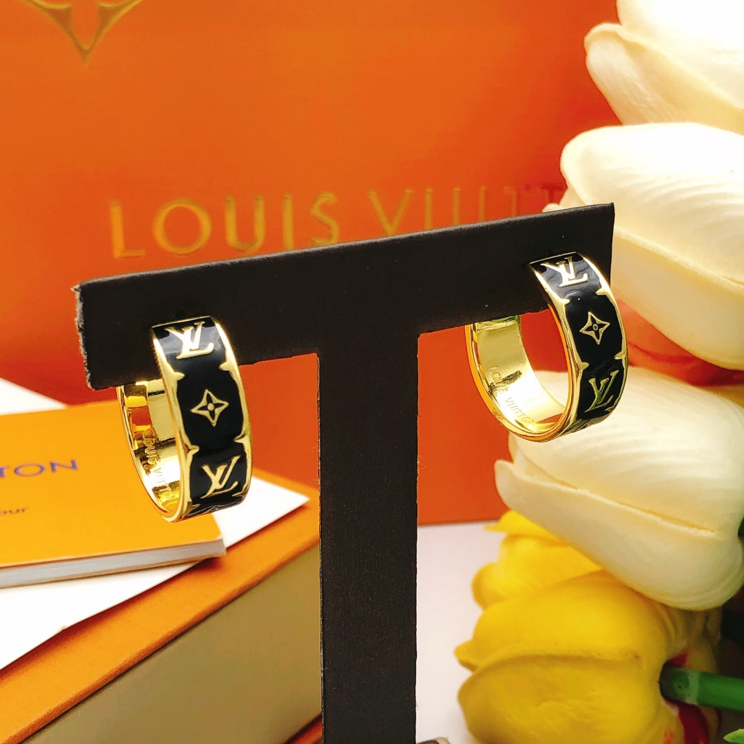 Martin Graham earrings in polished metal-tone – close-up detail