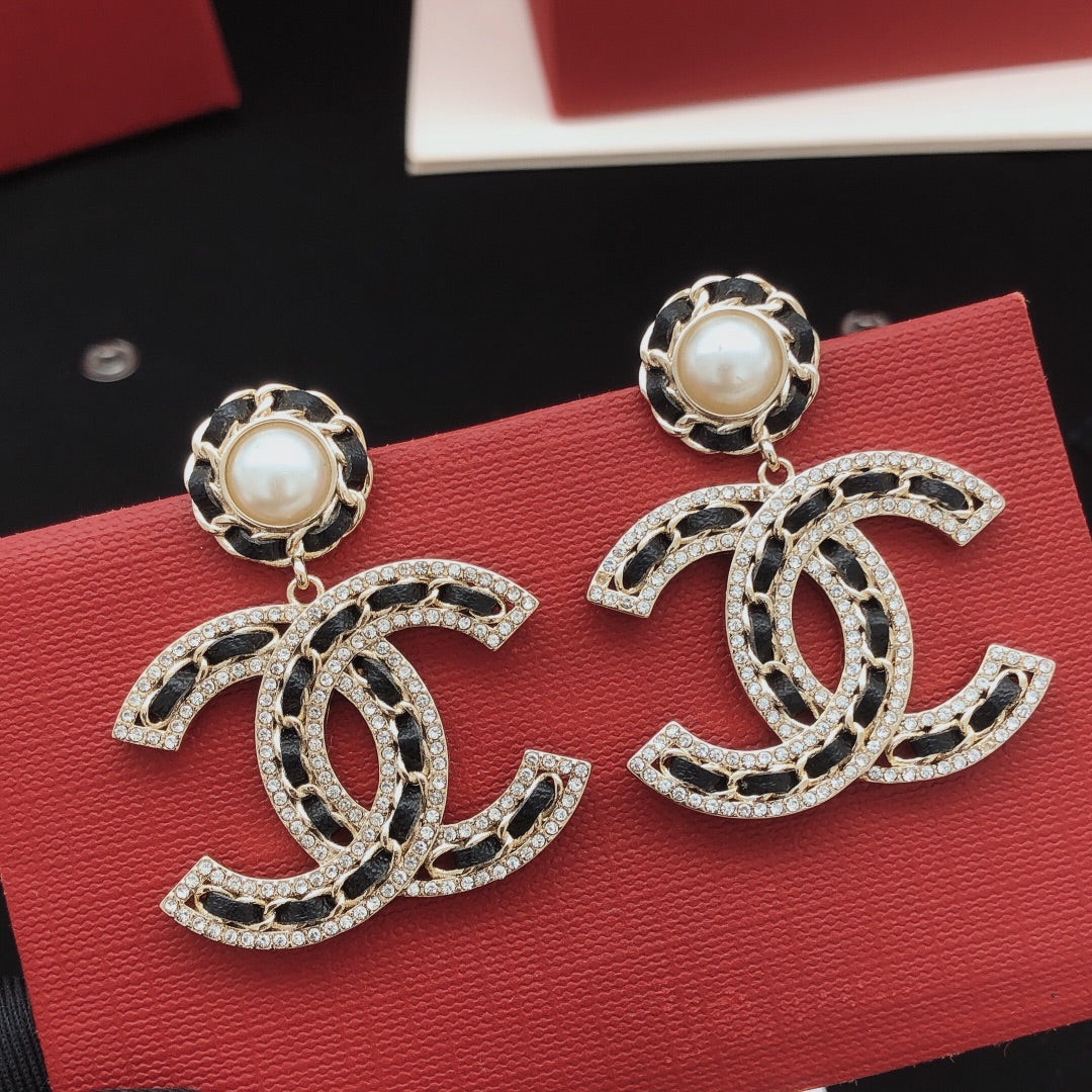 Martin Graham earrings in polished metal-tone – close-up detail