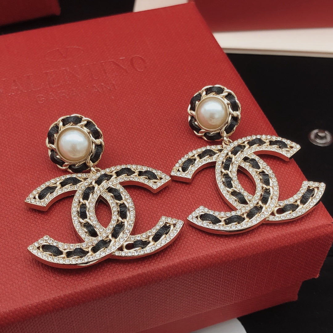 Martin Graham earrings in polished metal-tone – front product view