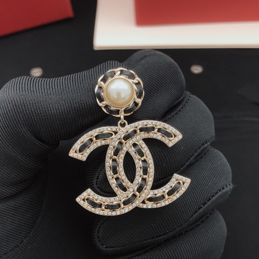 Martin Graham earrings in polished metal-tone – front product view