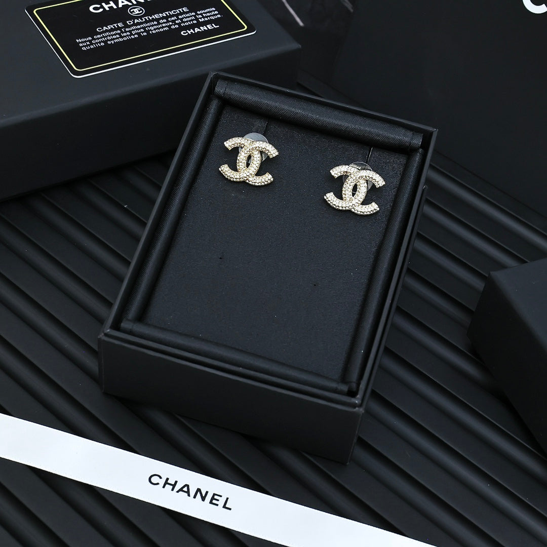 Martin Graham stud earrings in polished metal-tone – styled product view