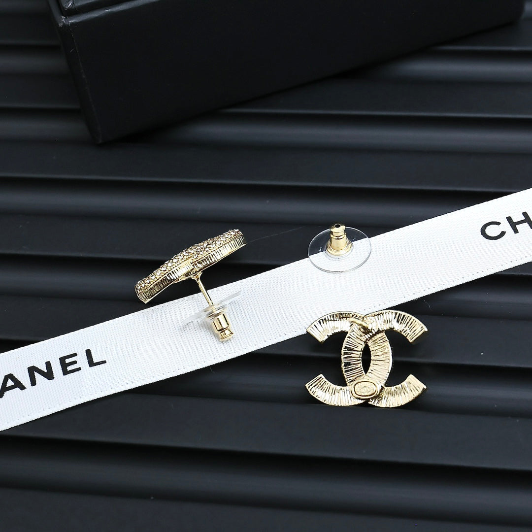 Martin Graham stud earrings in polished metal-tone – front product view