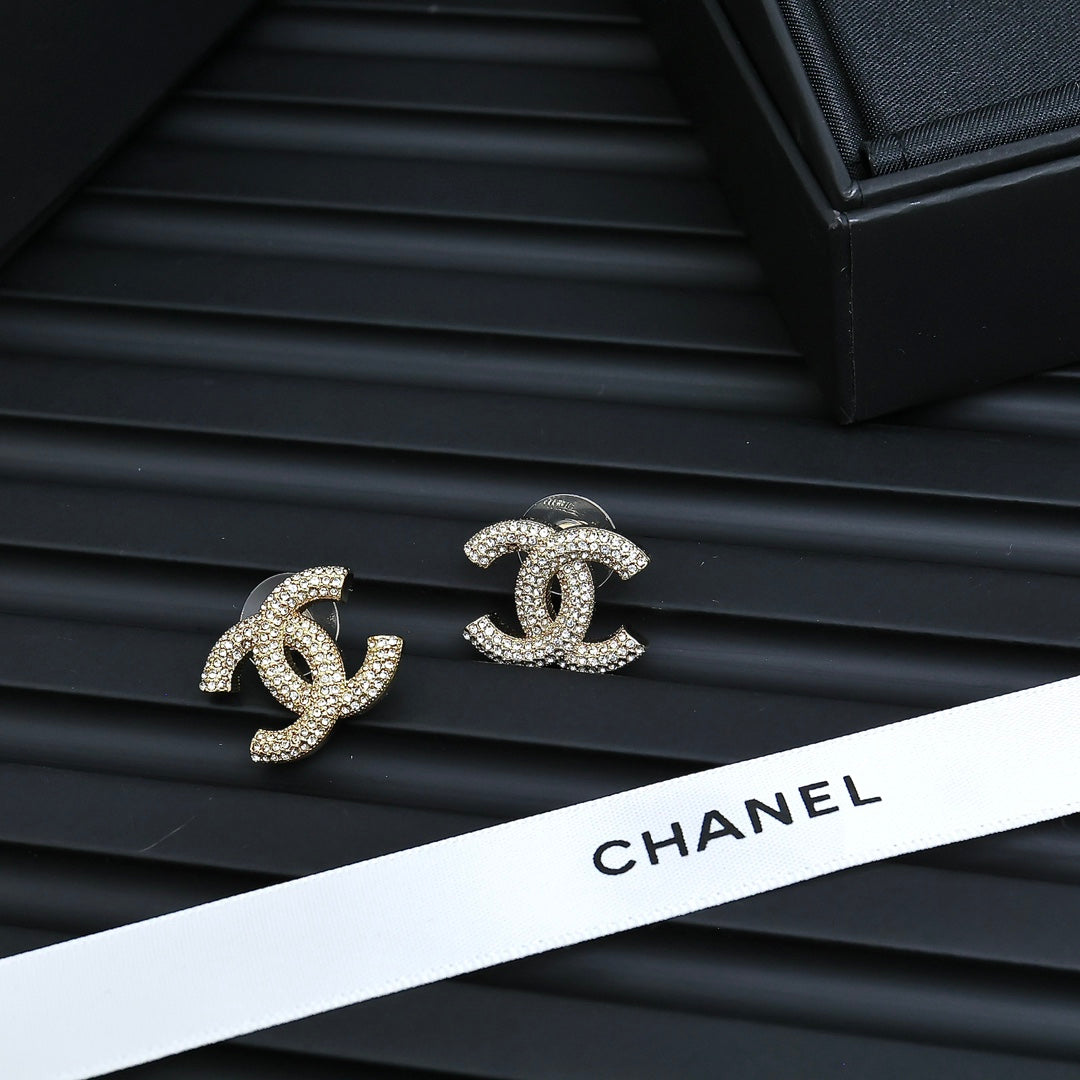 Martin Graham stud earrings in polished metal-tone – close-up detail
