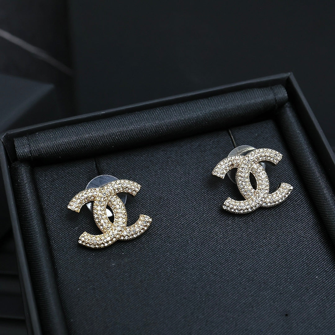 Martin Graham stud earrings in polished metal-tone – side detail