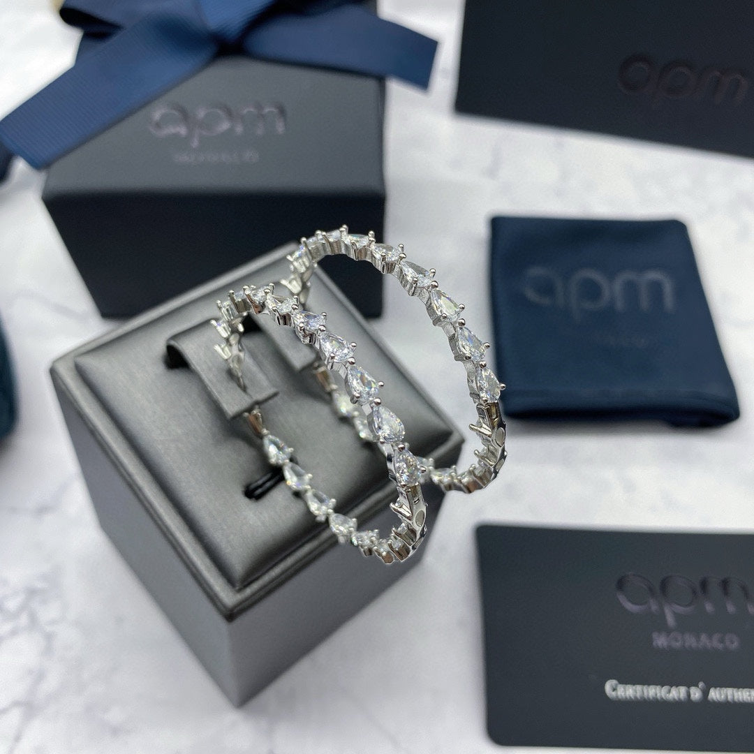 Martin Graham earrings in polished metal-tone – close-up detail