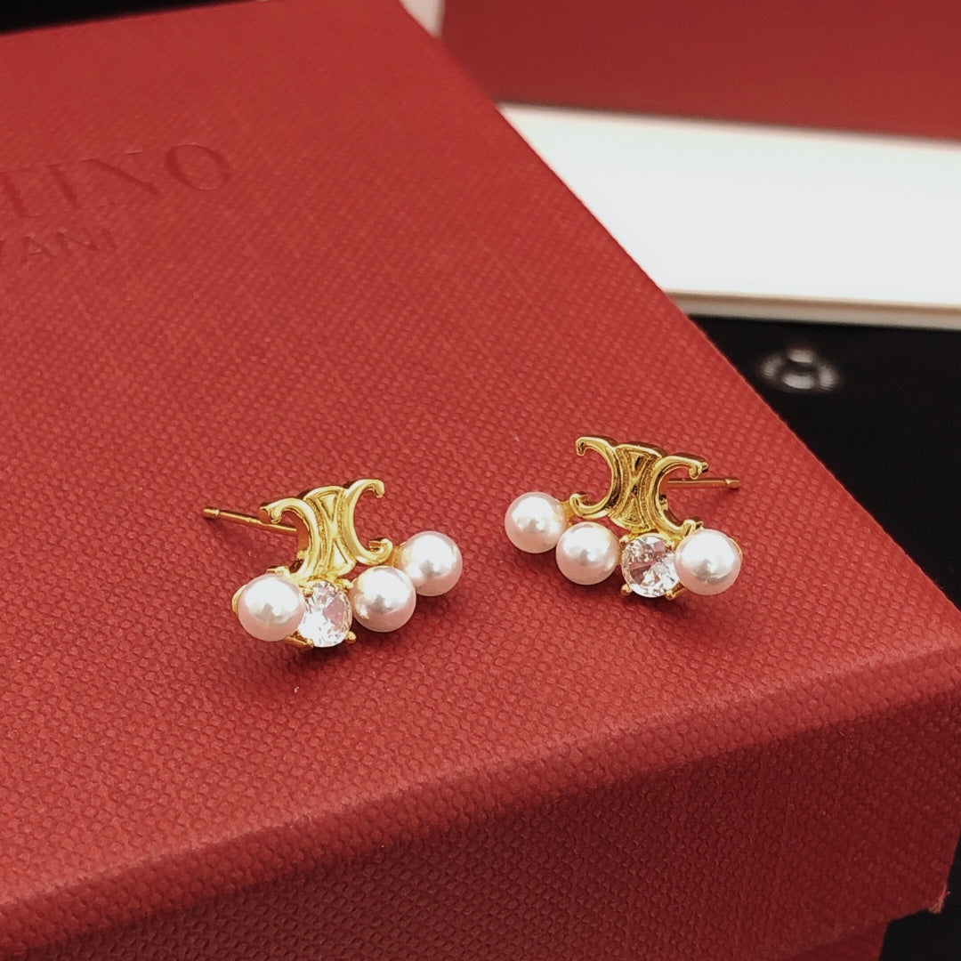 Martin Graham stud earrings in polished metal-tone