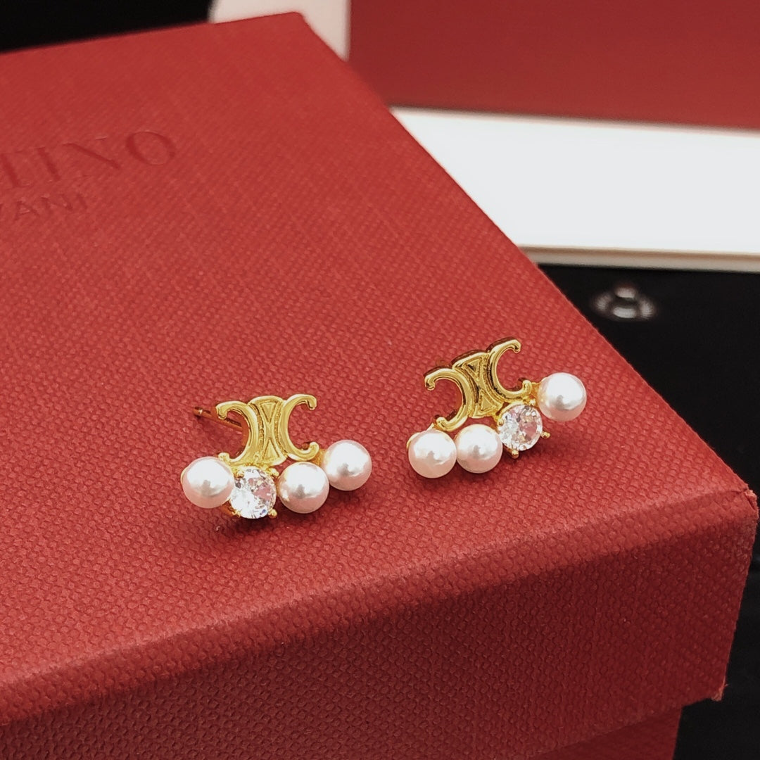 Martin Graham stud earrings in polished metal-tone