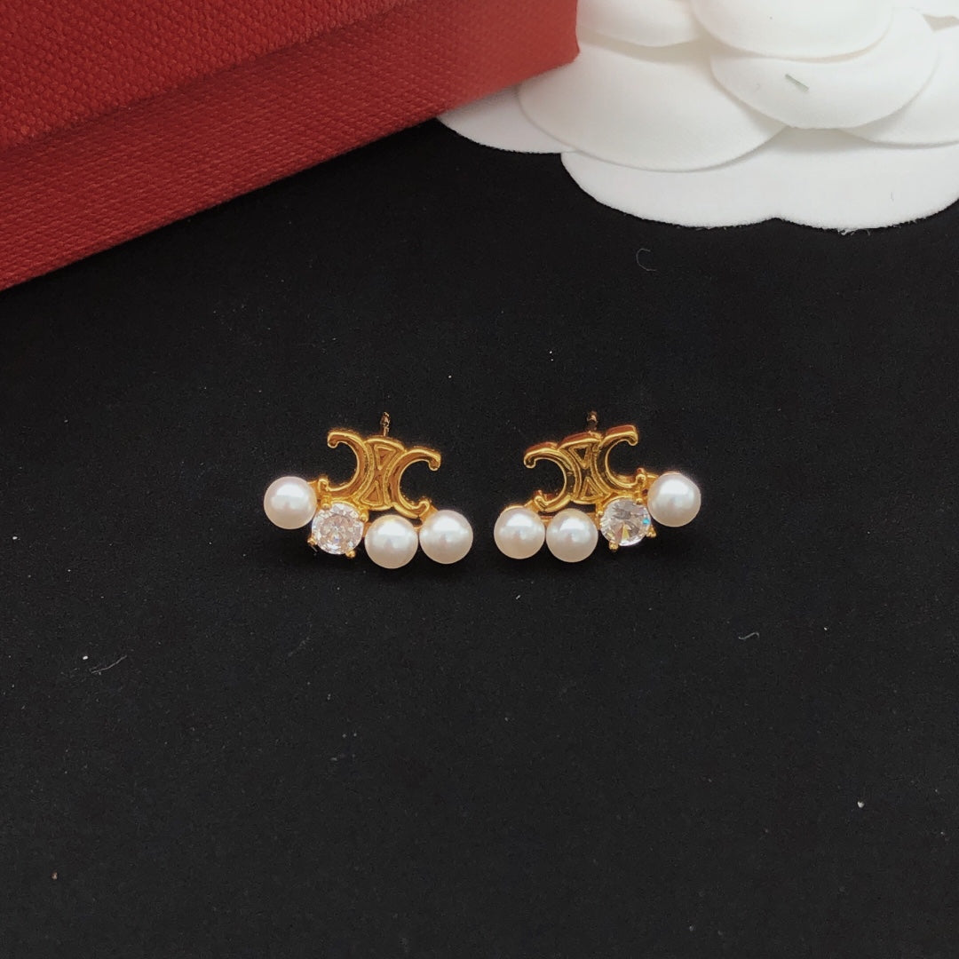 Martin Graham stud earrings in polished metal-tone – main product view