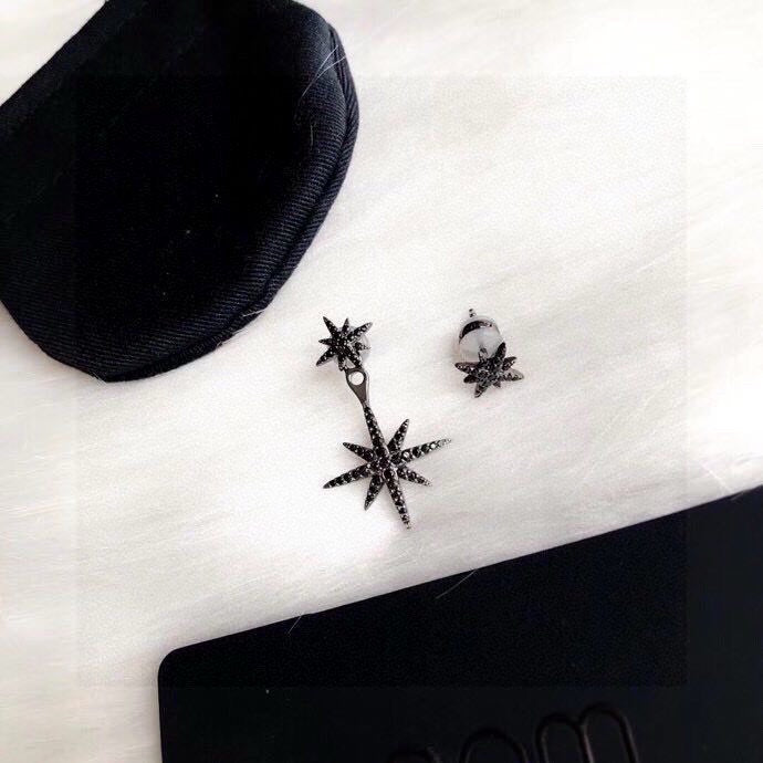 Martin Graham stud earrings in polished metal-tone – close-up detail