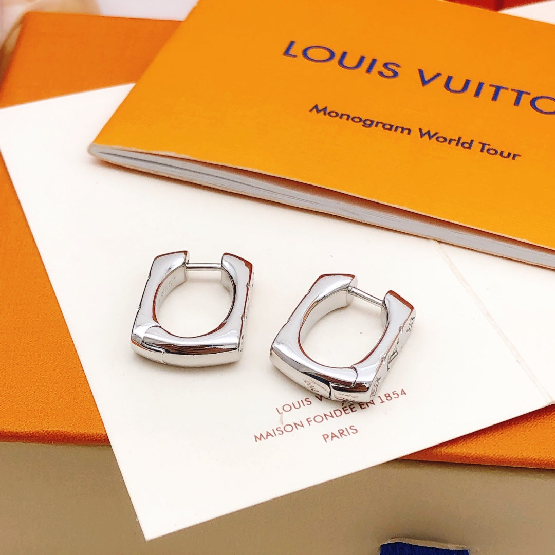 Martin Graham earrings in polished metal-tone – close-up detail