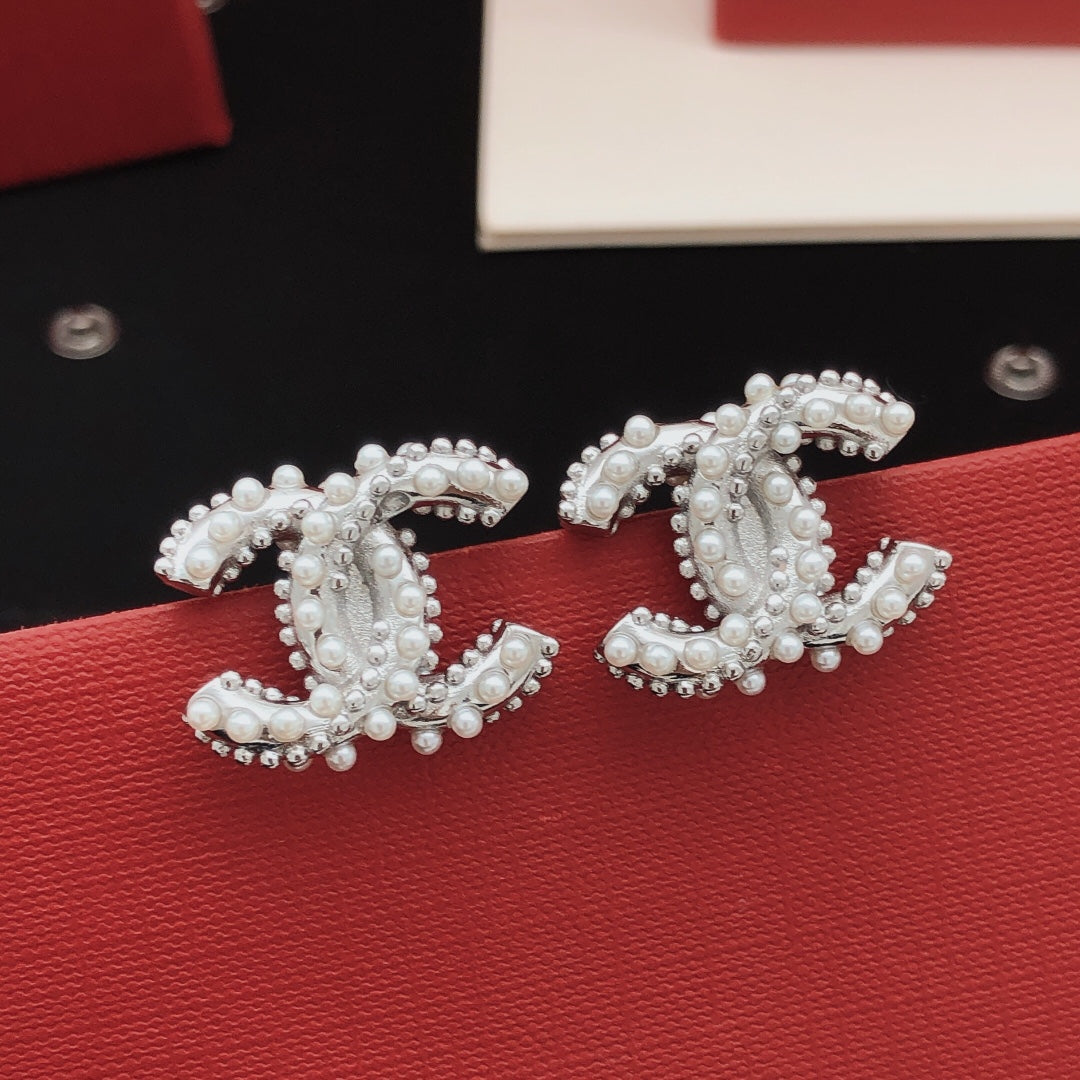 Martin Graham stud earrings in polished metal-tone – main product view