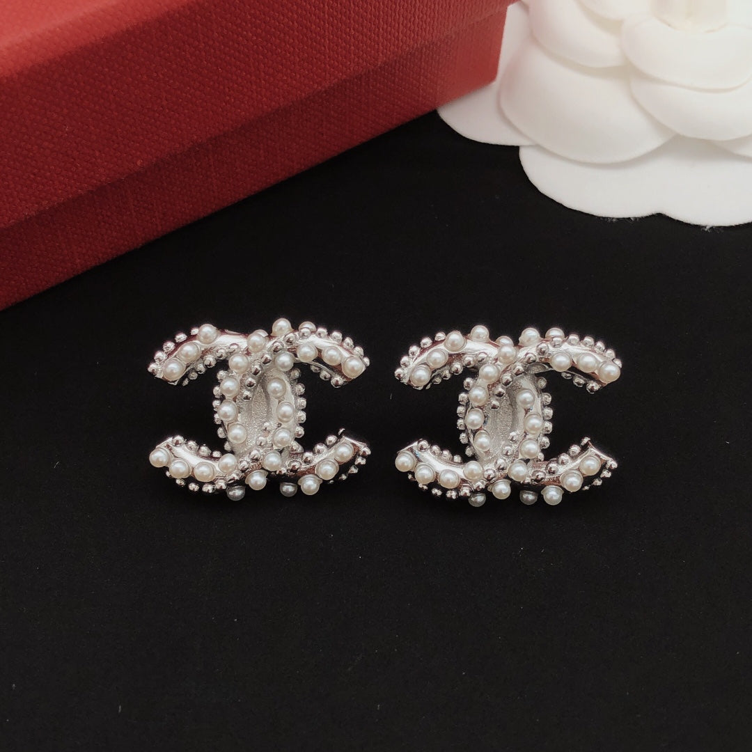 Martin Graham stud earrings in polished metal-tone – main product view