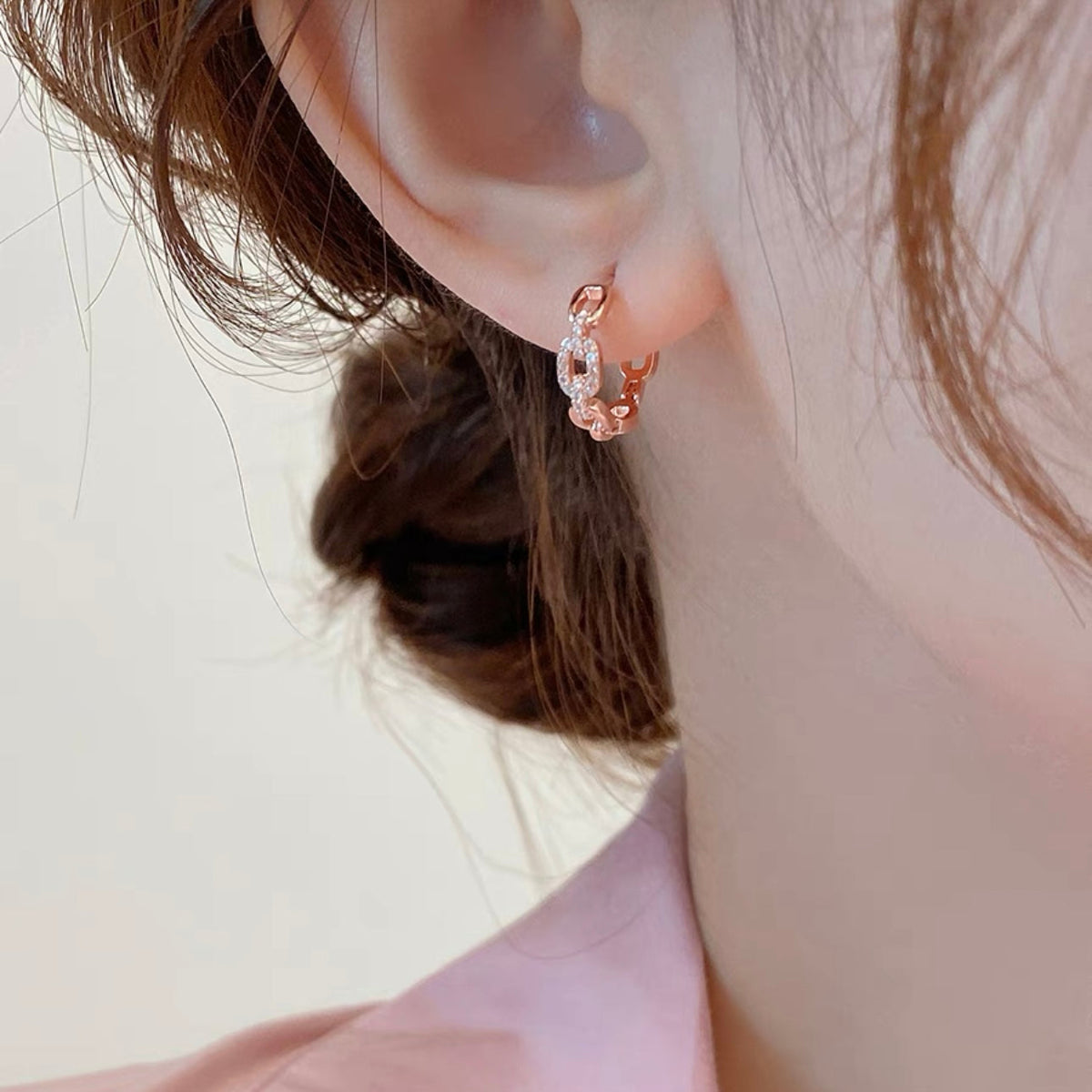Martin Graham stud earrings in polished metal-tone – styled product view