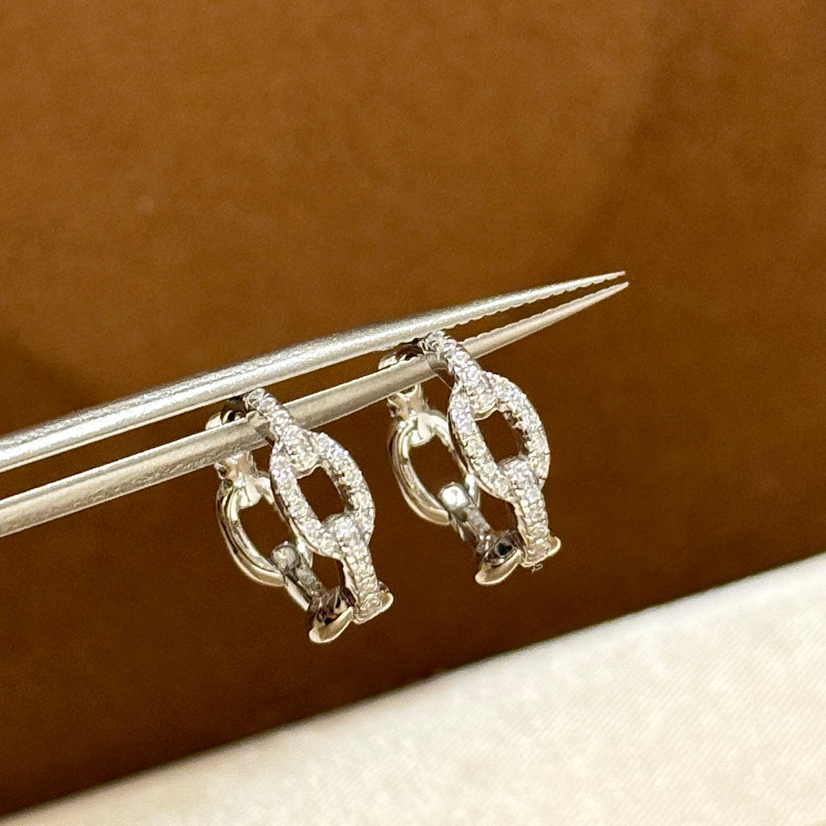 Martin Graham stud earrings in polished metal-tone – side detail