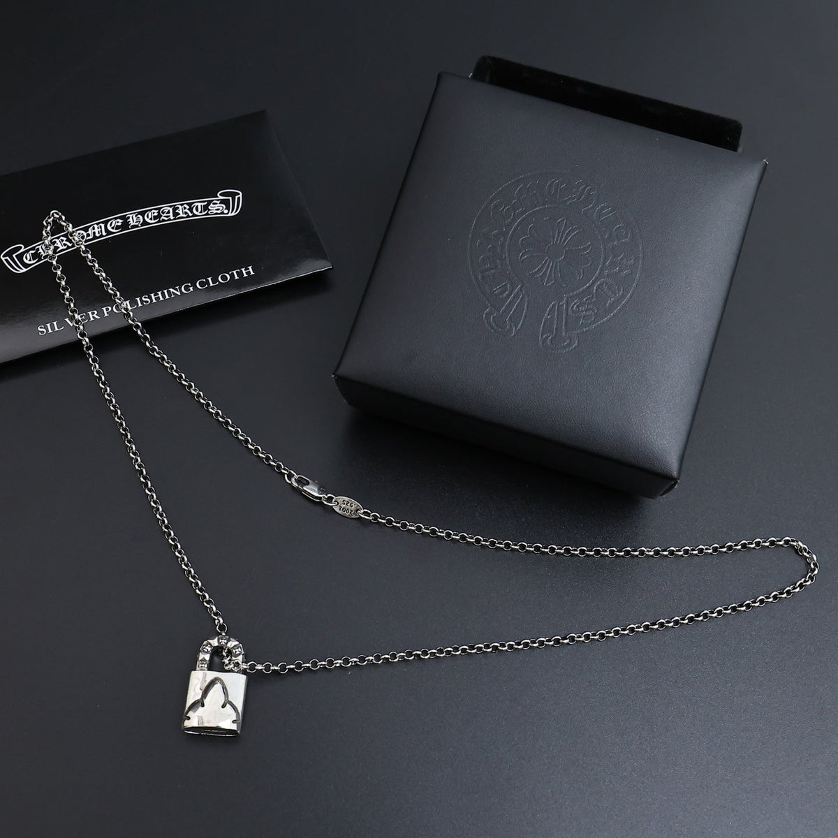 Martin Graham pendant necklace in polished metal-tone – close-up detail