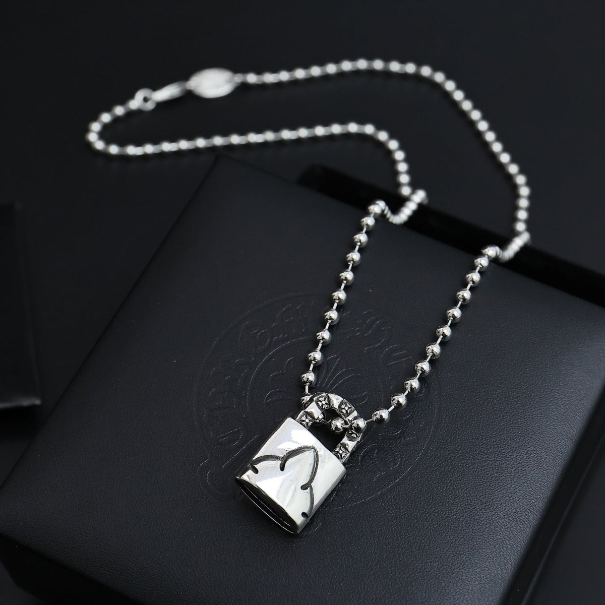 Martin Graham pendant necklace in polished metal-tone – detail view