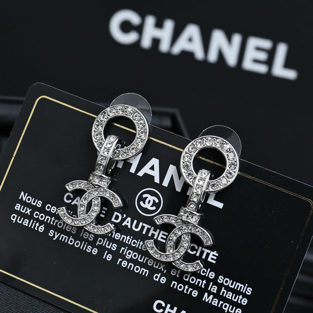 Martin Graham earrings in polished metal-tone – close-up detail