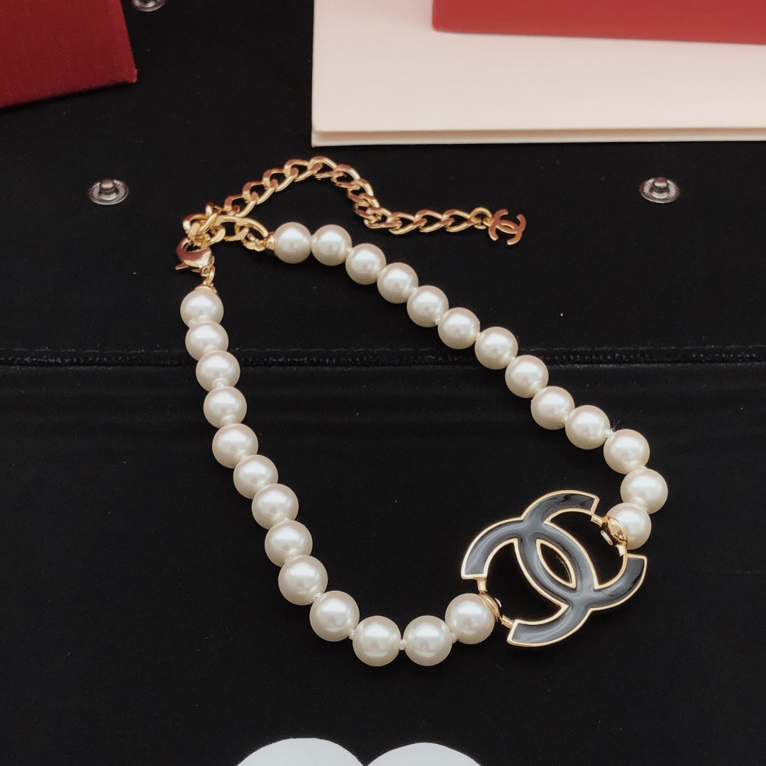 Martin Graham pendant necklace in polished metal-tone – front product view