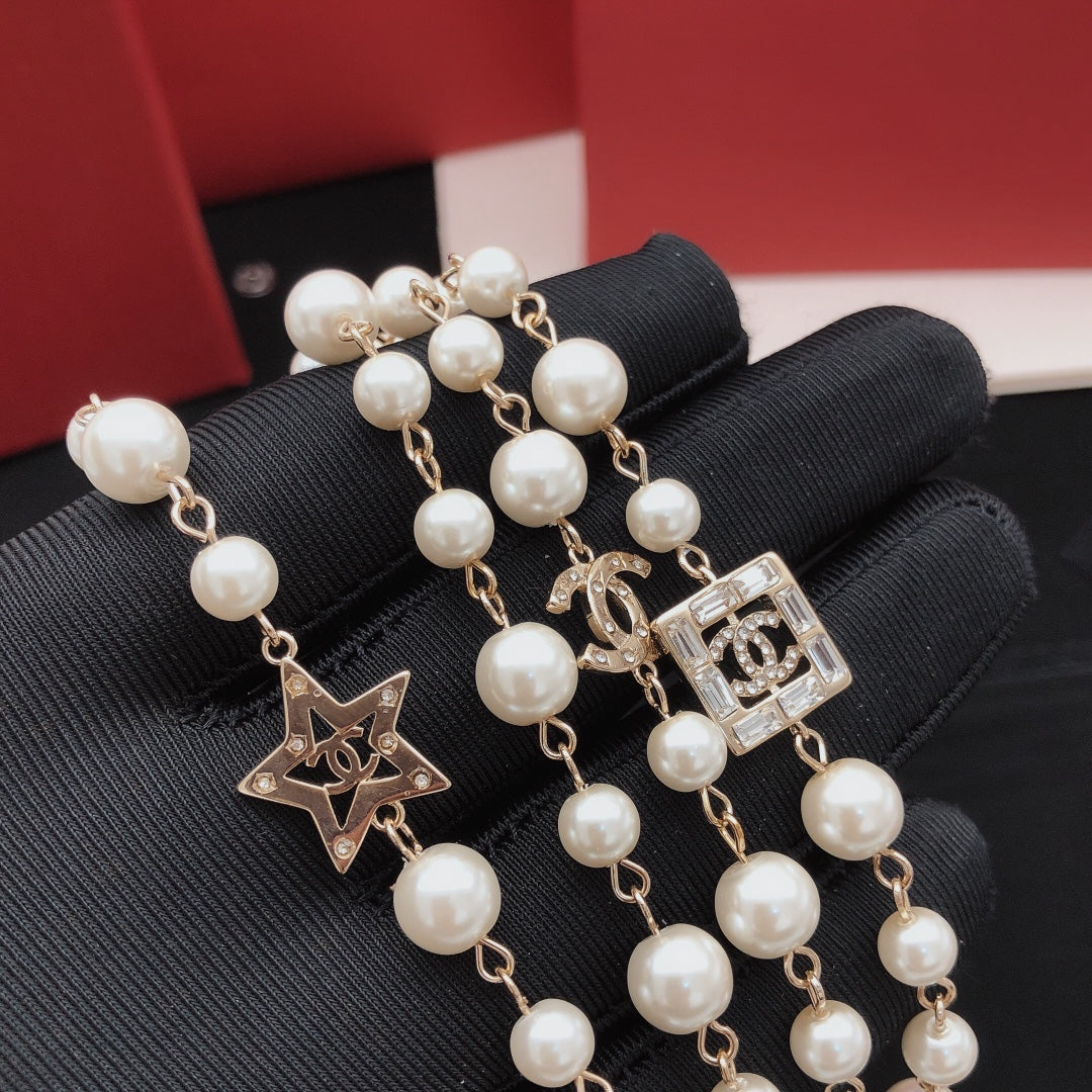 Martin Graham pendant necklace in polished metal-tone – detail view