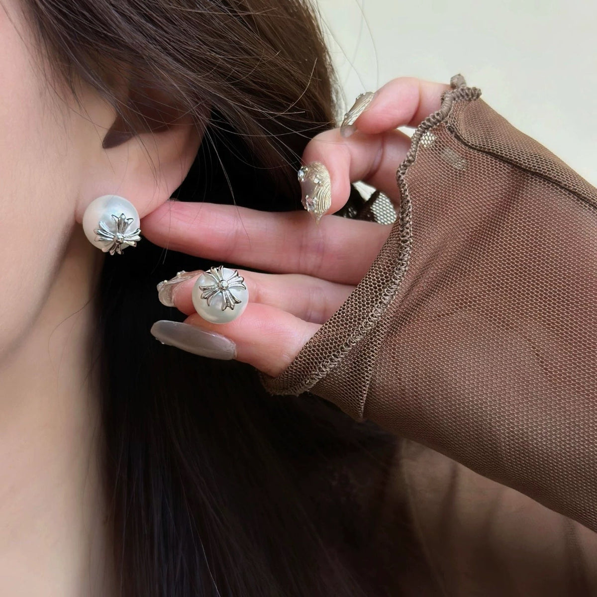Martin Graham stud earrings in polished metal-tone – detail view
