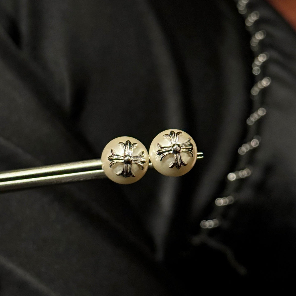 Martin Graham stud earrings in polished metal-tone – close-up detail