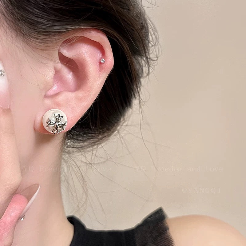 Martin Graham stud earrings in polished metal-tone – styled product view