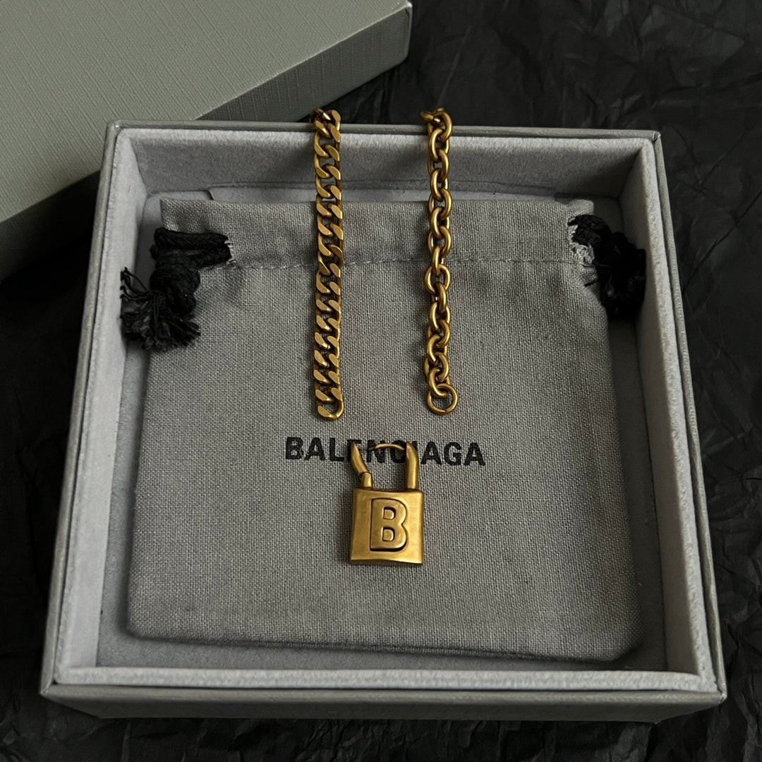 Martin Graham pendant necklace in polished metal-tone – close-up detail