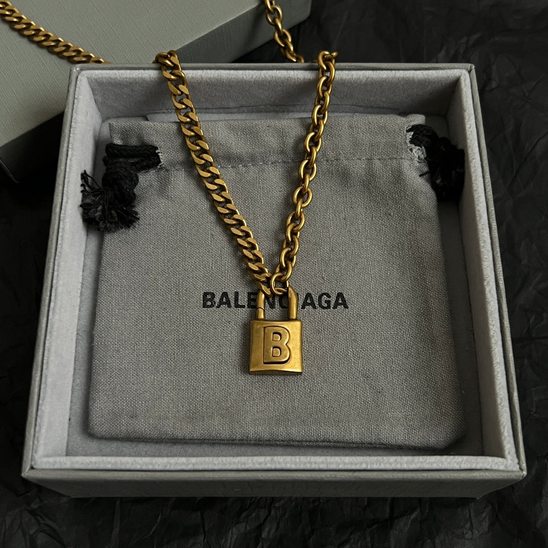 Martin Graham pendant necklace in polished metal-tone – side detail