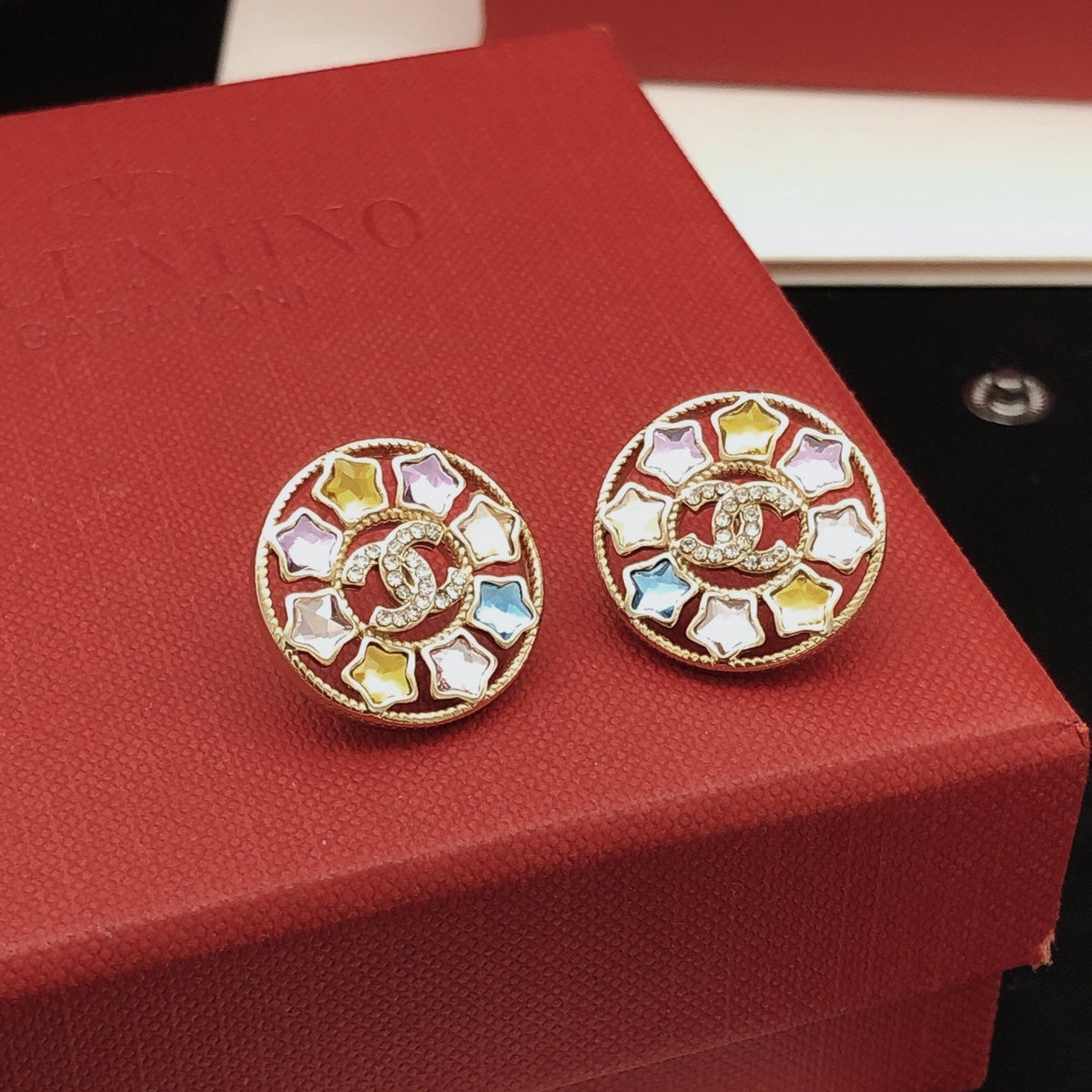 Martin Graham stud earrings in polished metal-tone – close-up detail