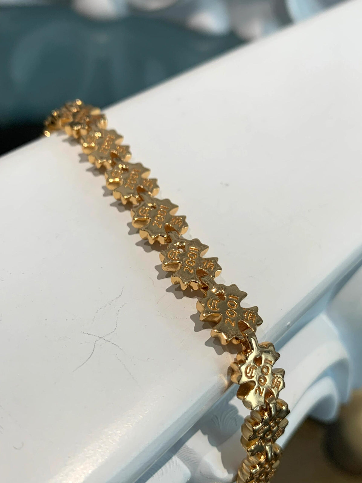 Martin Graham jewelry accessory in polished metal-tone – side detail