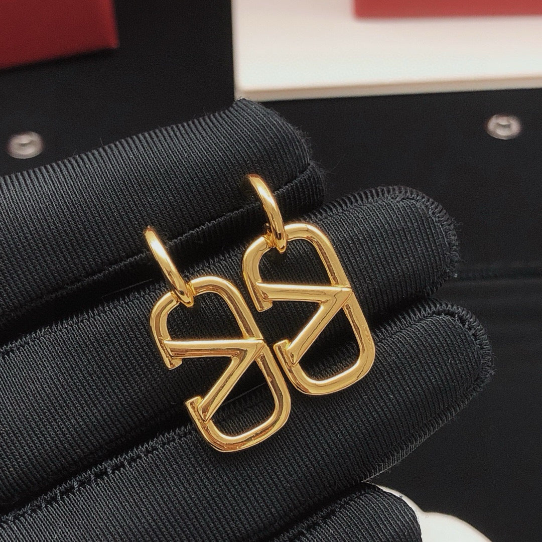 Martin Graham drop earrings in polished metal-tone – detail view