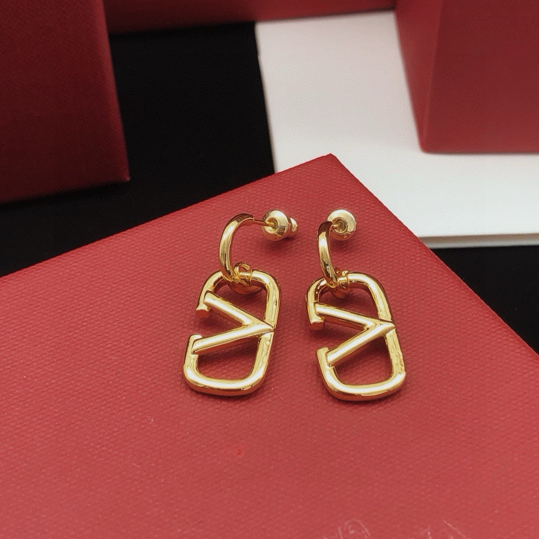 Martin Graham drop earrings in polished metal-tone