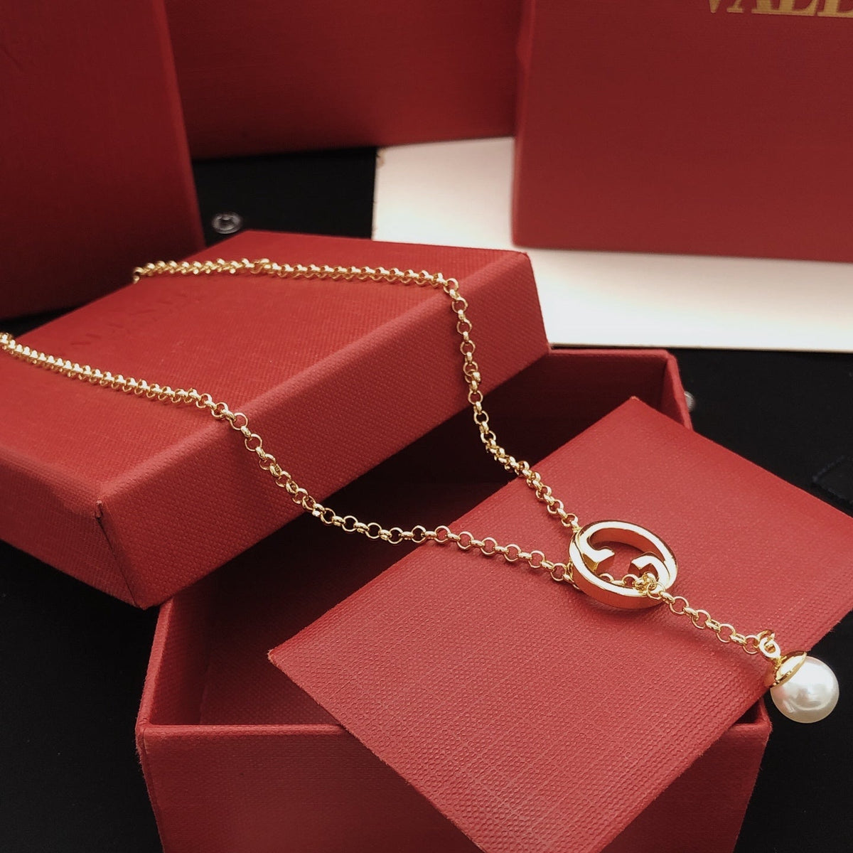 Martin Graham pendant necklace in polished metal-tone – side detail
