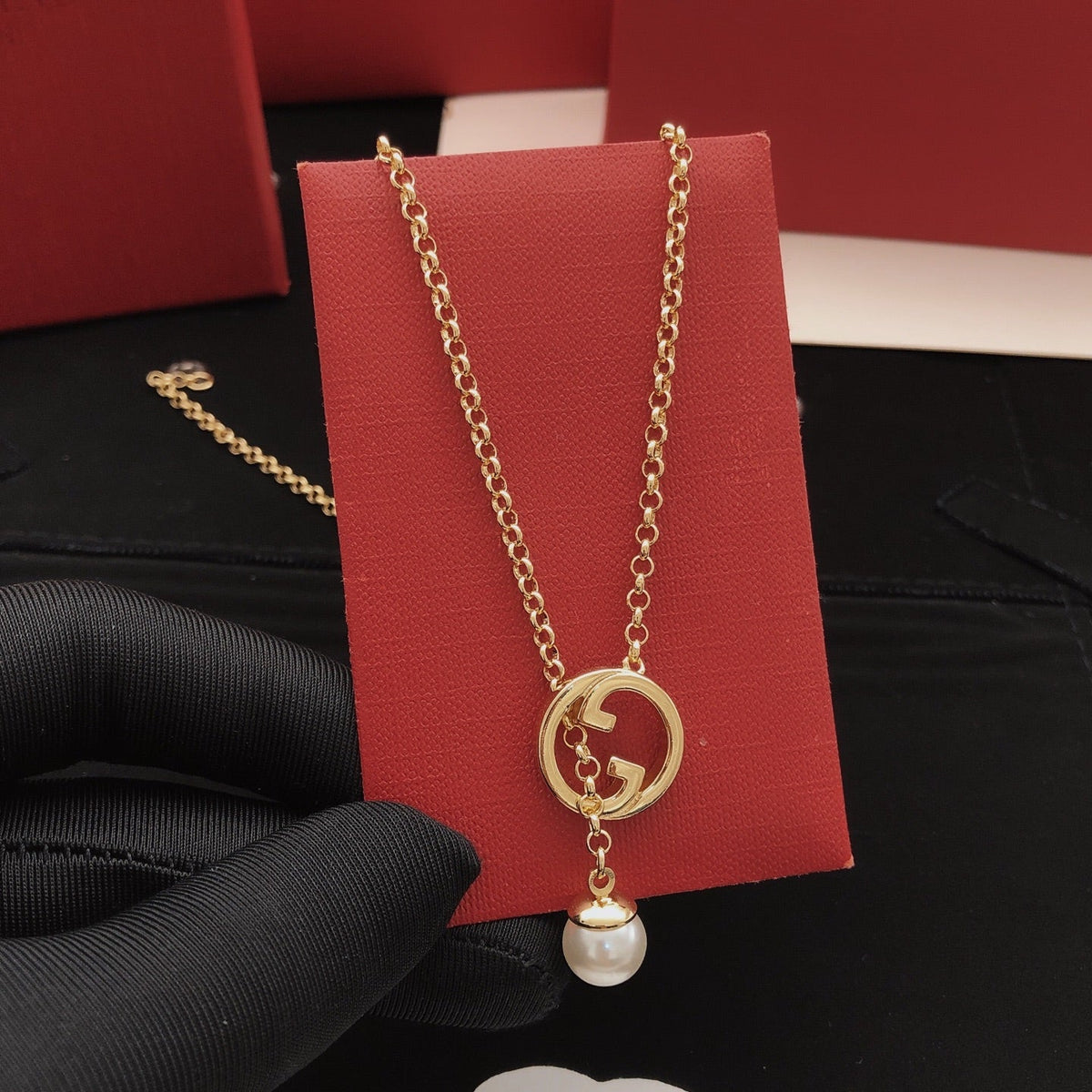 Martin Graham pendant necklace in polished metal-tone – detail view