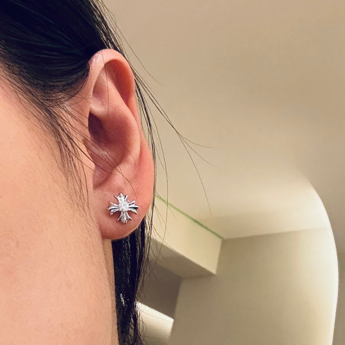 Martin Graham stud earrings in polished metal-tone – detail view