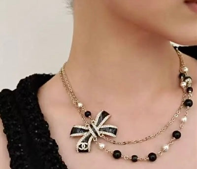 Martin Graham pendant necklace in polished metal-tone – detail view