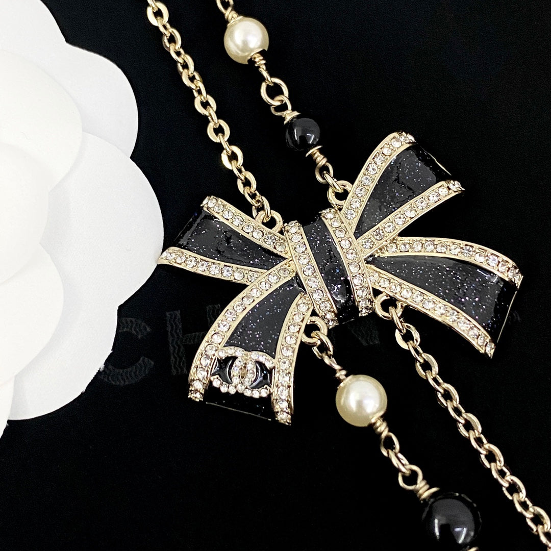 Martin Graham pendant necklace in polished metal-tone – detail view