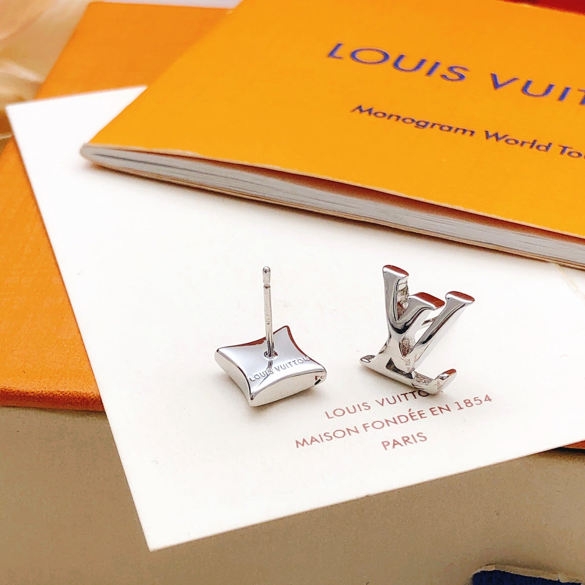 Martin Graham stud earrings in polished metal-tone – front product view