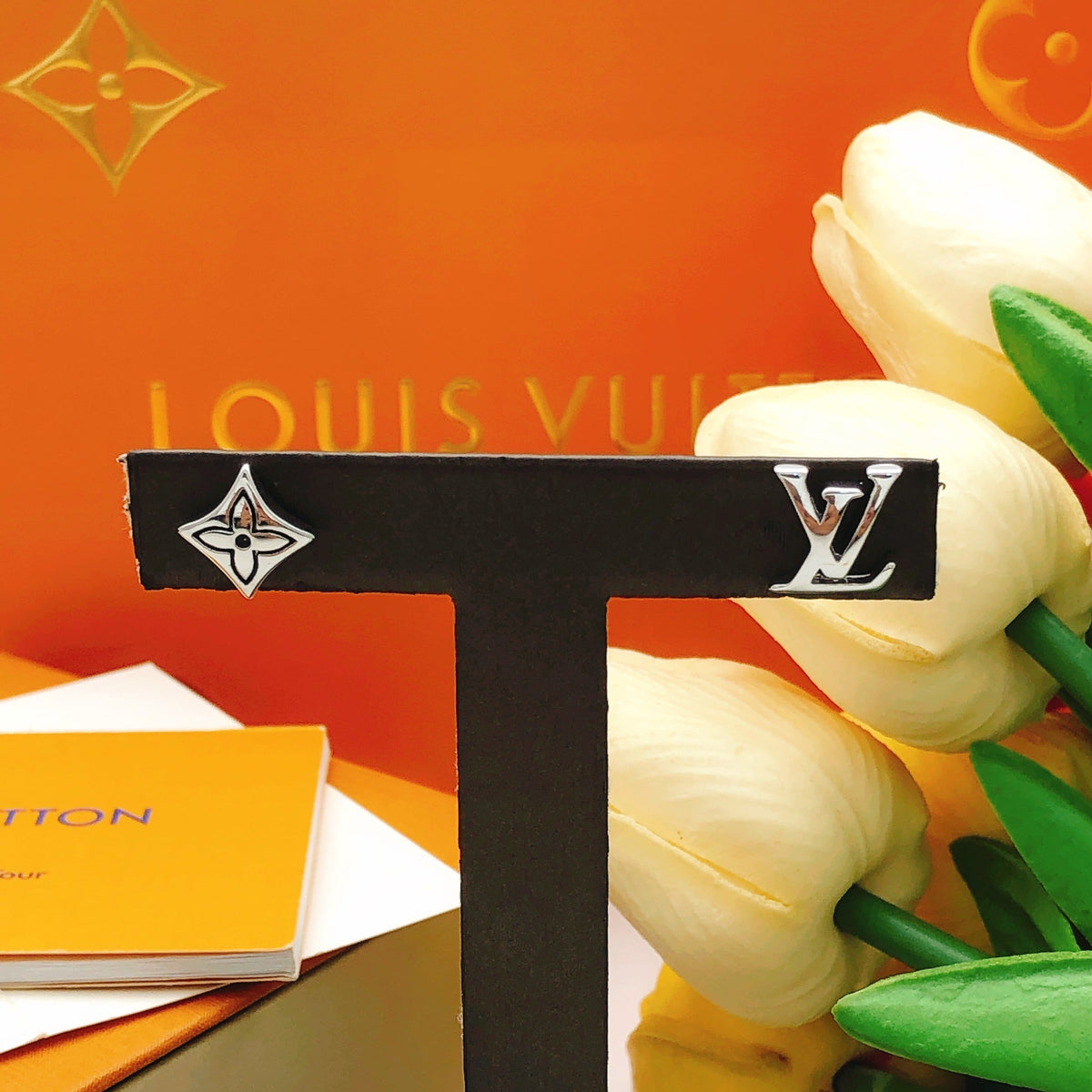 Martin Graham stud earrings in polished metal-tone – close-up detail