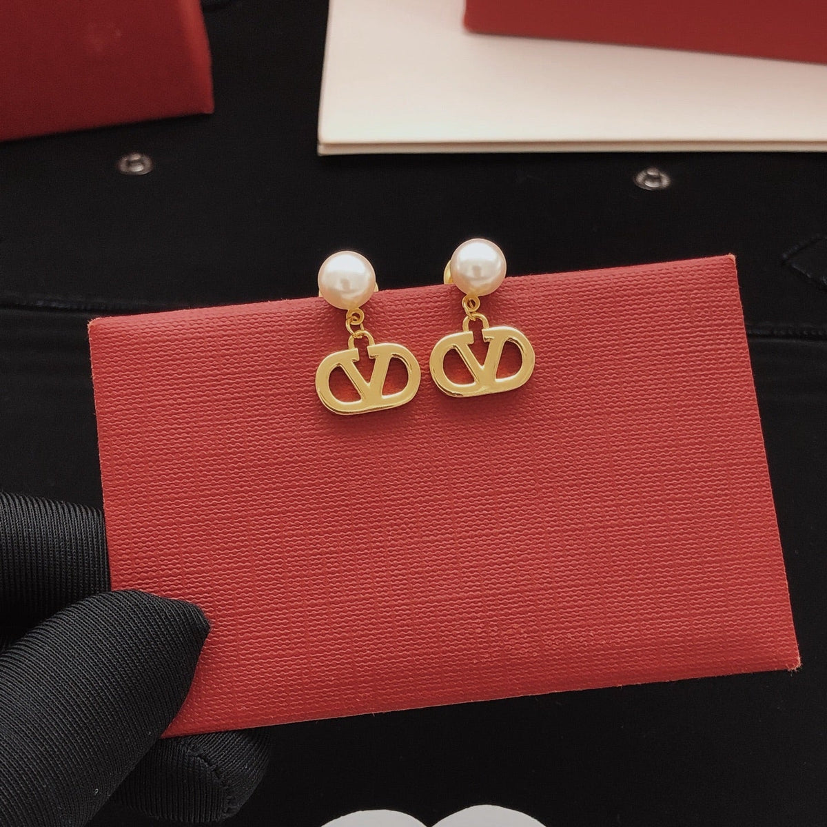 Martin Graham stud earrings in polished metal-tone – front view