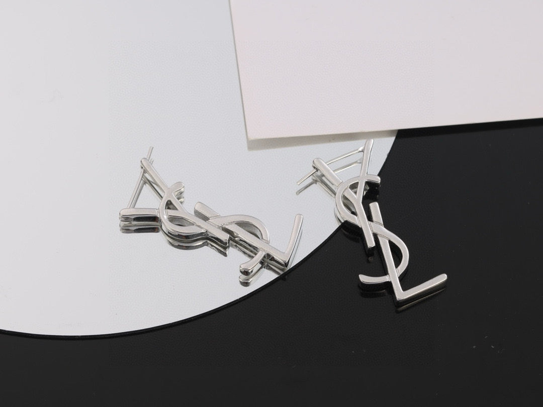 Martin Graham stud earrings in polished metal-tone – close-up detail