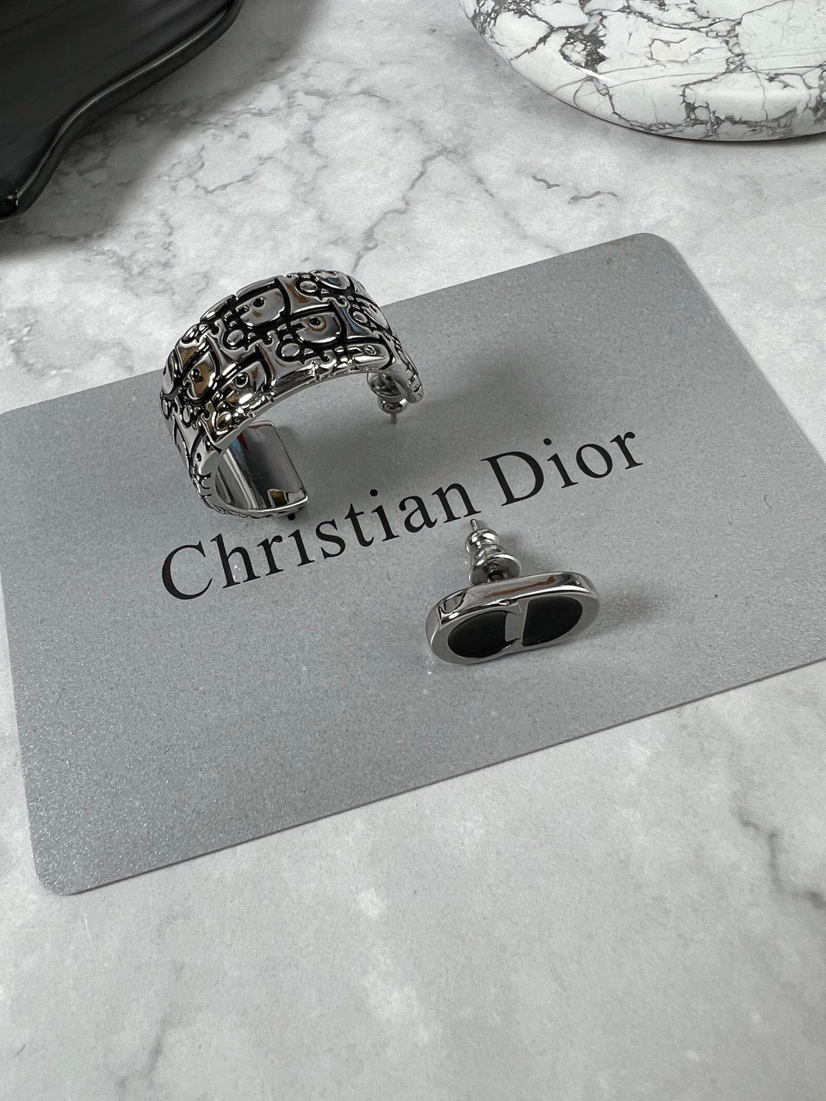 Martin Graham stud earrings in polished metal-tone – front view