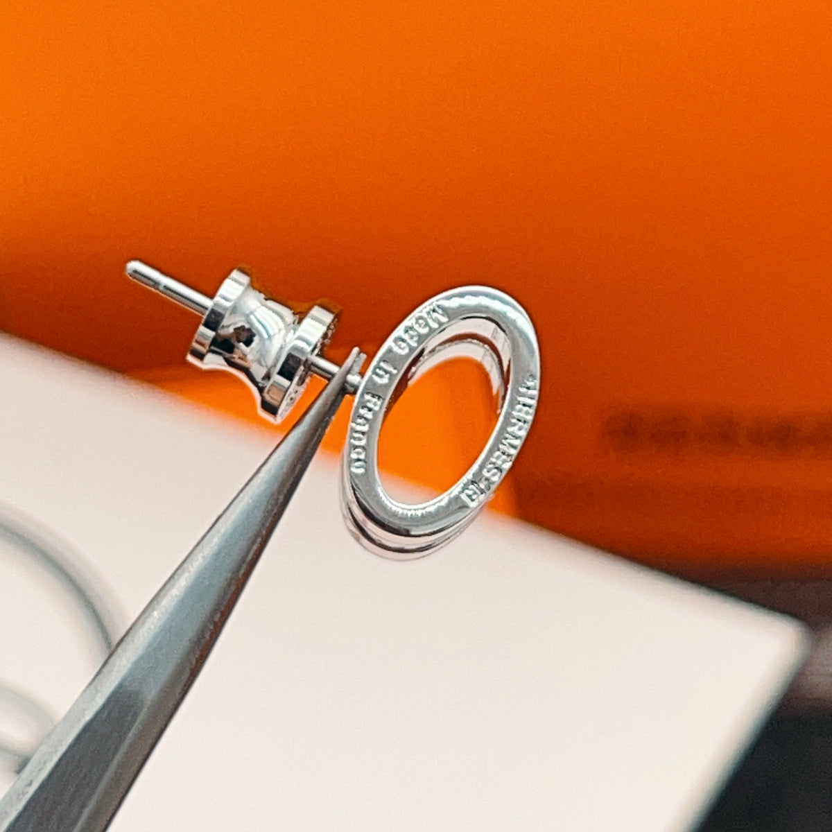 Martin Graham stud earrings in polished metal-tone – styled product view
