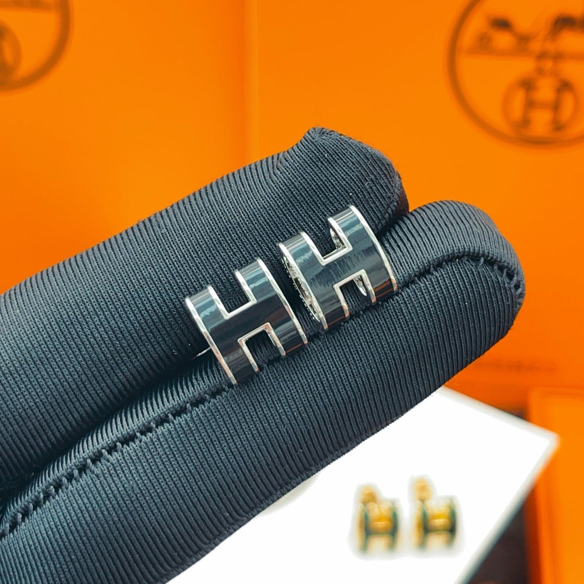 Martin Graham stud earrings in polished metal-tone – styled product view
