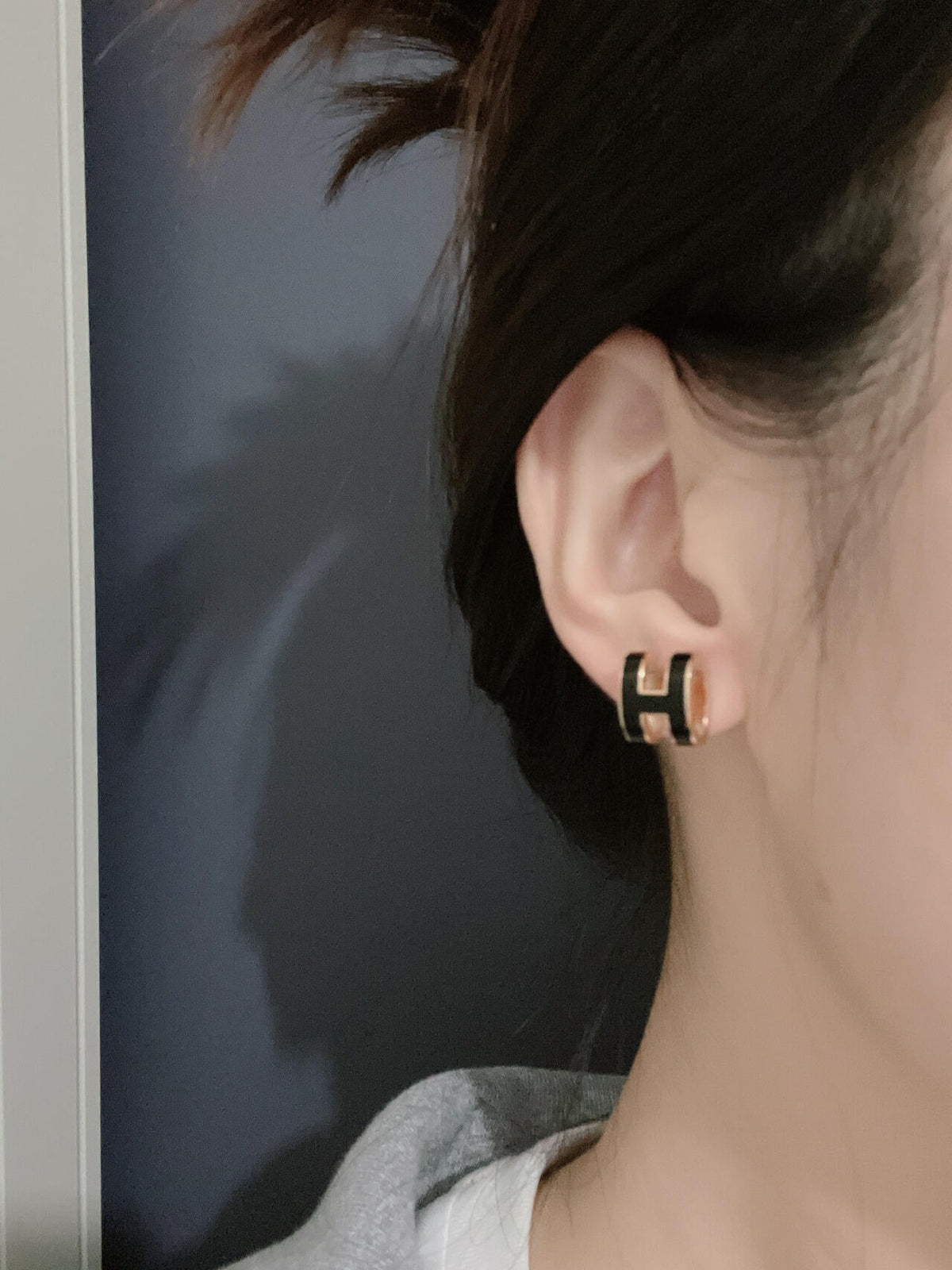 Martin Graham stud earrings in polished metal-tone – side detail